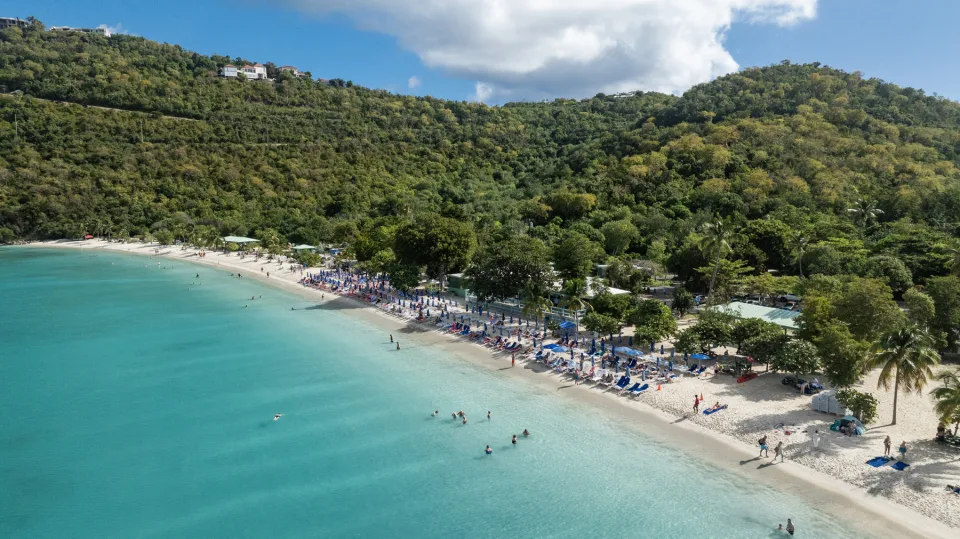 Aerial view of Magens Bay beach in St. Thomas, with turquoise water, white sand and green hills